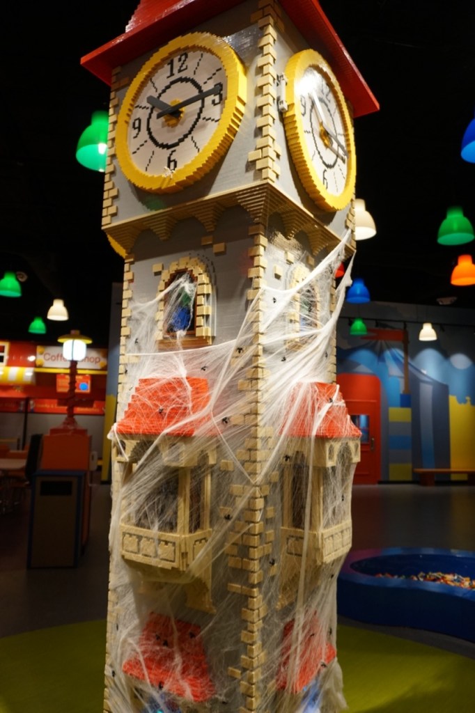 The clock tower is the center of the Discovery Center and it's decked out for Brick or Treat.