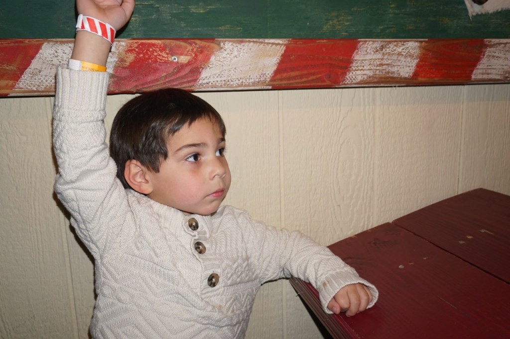 Here he is, raising his hand. He was taking Elf University very seriously!
