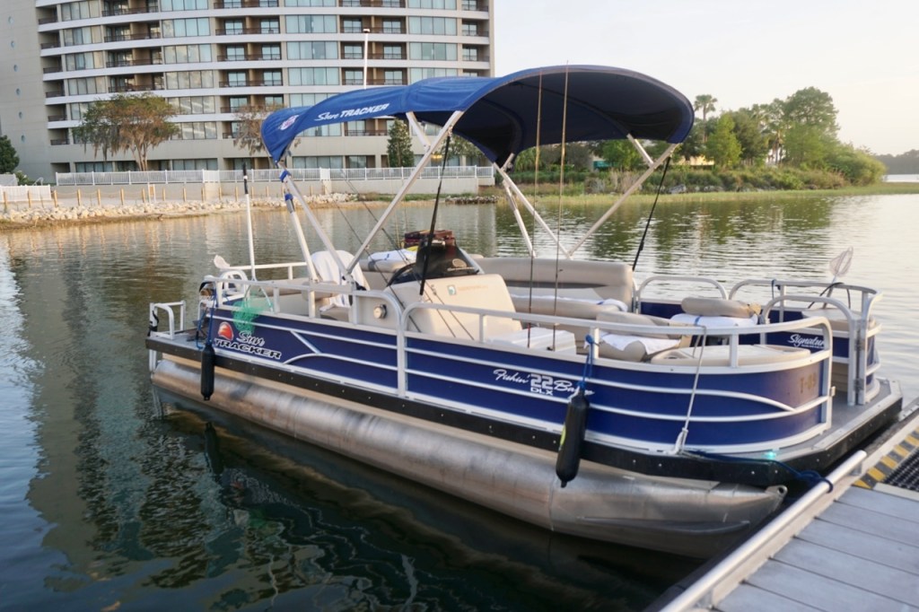 The seats in the fishing boat make it comfortable for the person to sit down while fishing.