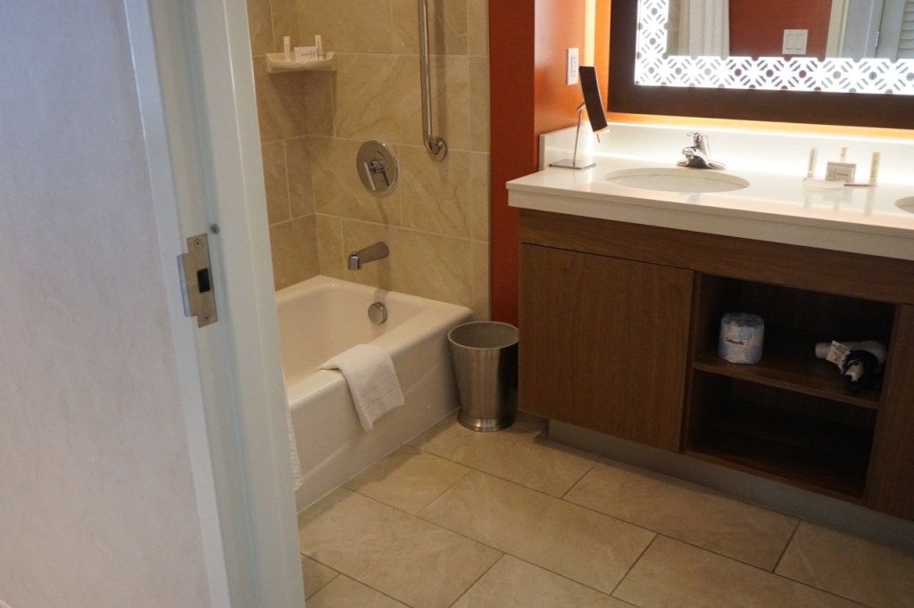 The bathrooms are huge, with a bathtub on one side, and a shower on the other side. 