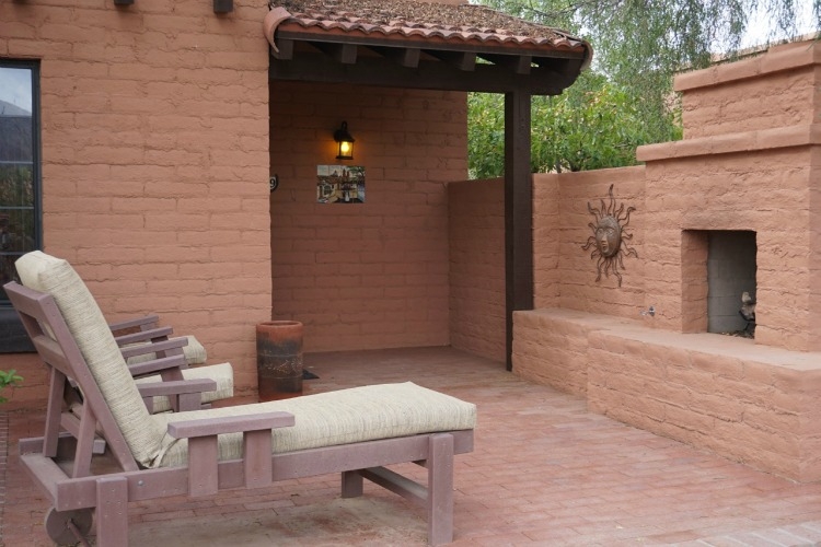 The rooms at the White Stallion Ranch have patios with lounge chairs and an outdoor fireplace.