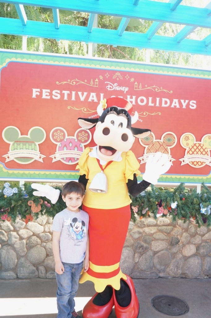 My son was able to have his picture taken with Clarabelle in Disney California Adventure during the holidays!