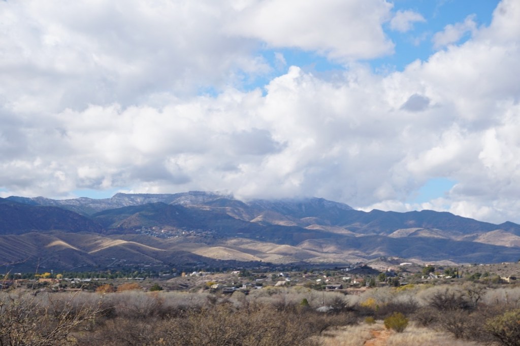 There are several towns near Sedona that you can explore, like the town of Jerome, which can be seen in the distance.