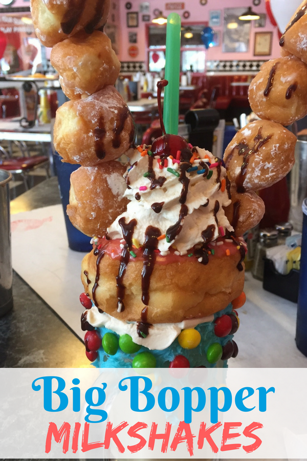 Introducing the Big Bopper Milkshakes at Little Anthony's Diner, a 50s themed restaurant in Tucson, Arizona. With ingredients like donut holes, donuts, twinkles, hostess cupcakes, skittles, pretzels, licorice, and cake, it's one of the many reasons to travel to Tucson for a family vacation.